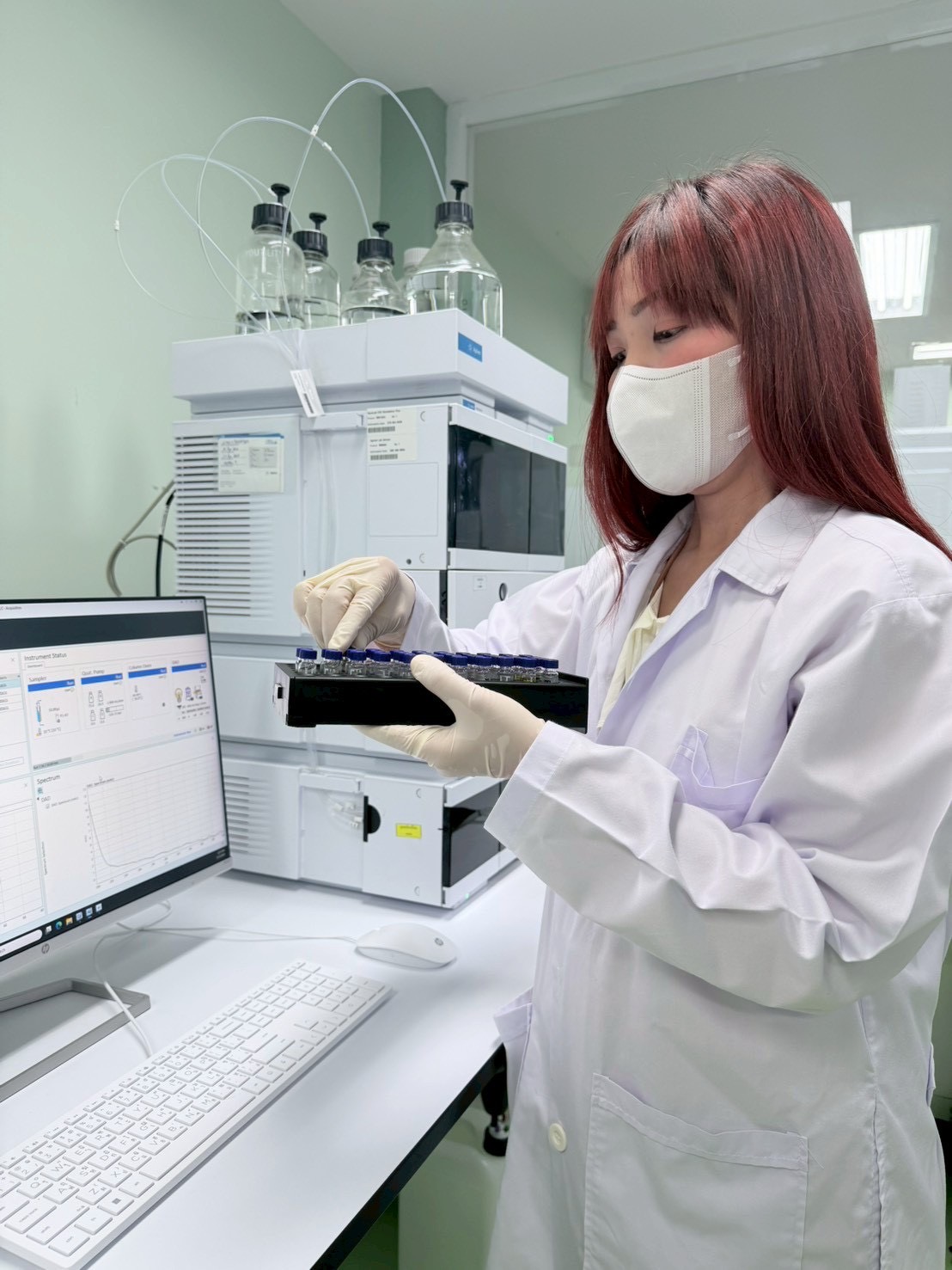 Analyst preparing sample vials at our pharmaceutical manufacturing facility